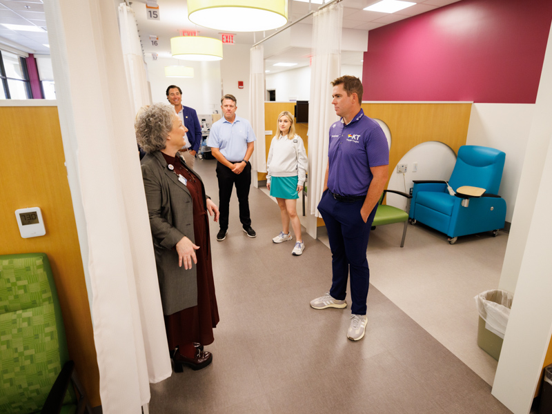 Ellen Hansen, Children's of Mississippi chief operations officer and chief nursing officer, gives 2023 Sanderson Farms Championship winner Luke List a tour of the newly renovated Center for Cancer and Blood Disorders.